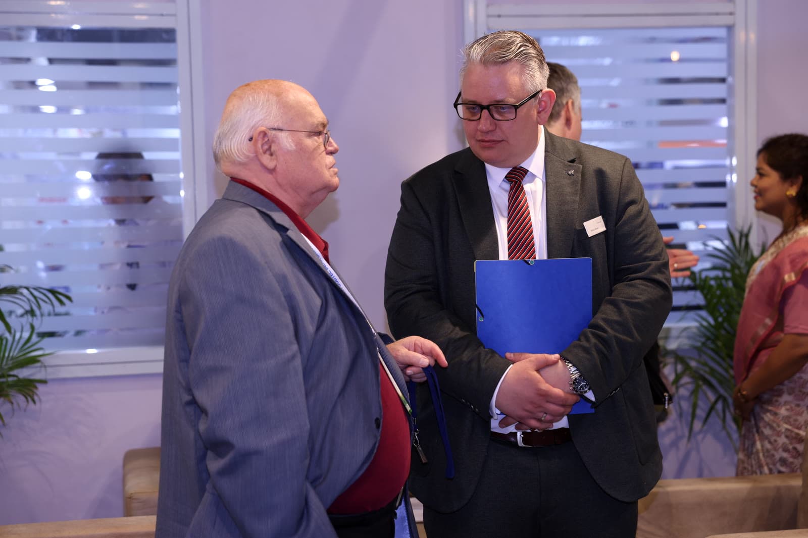 Two delegates in private conversation