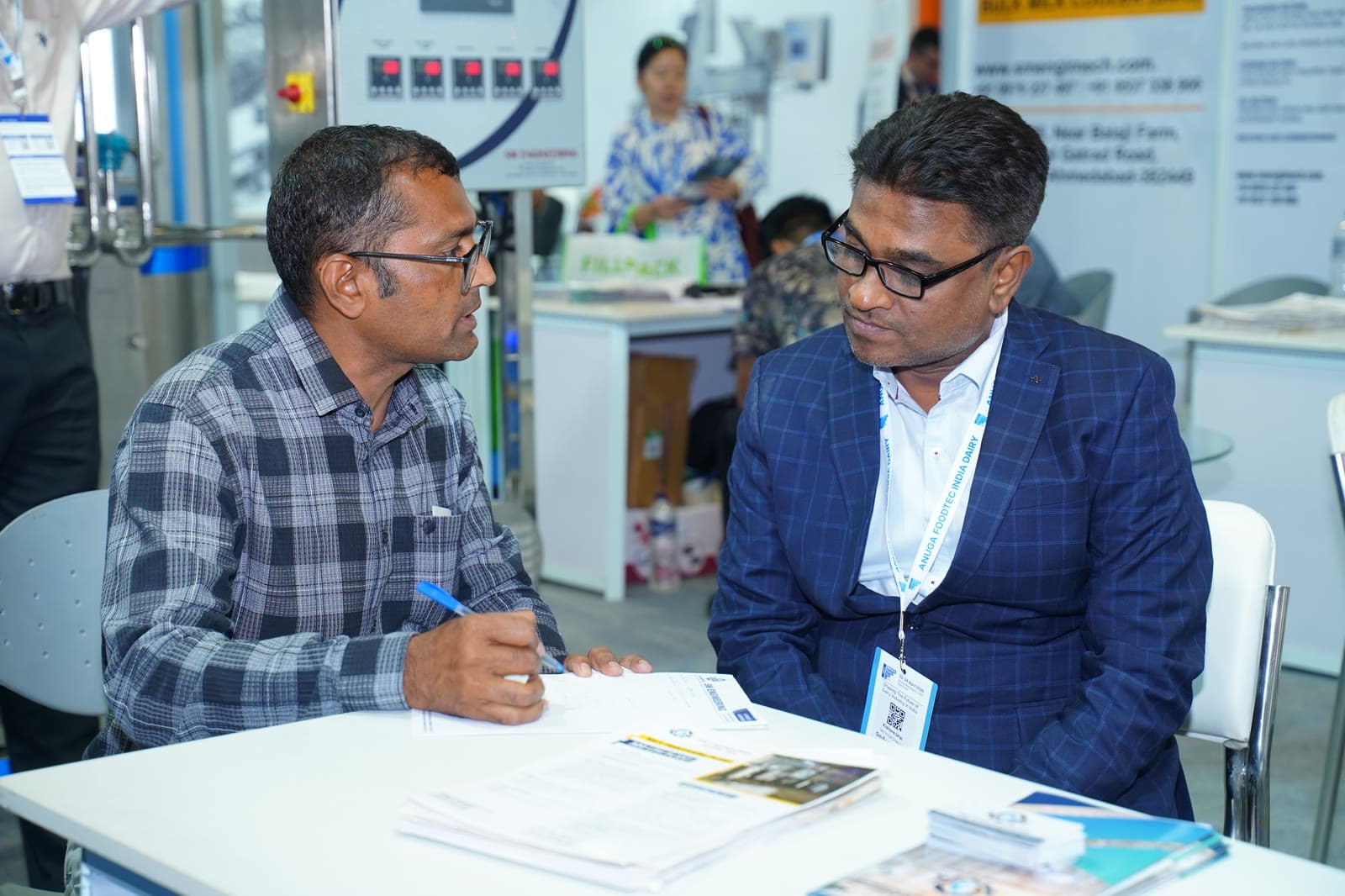 Business meeting at exhibition table