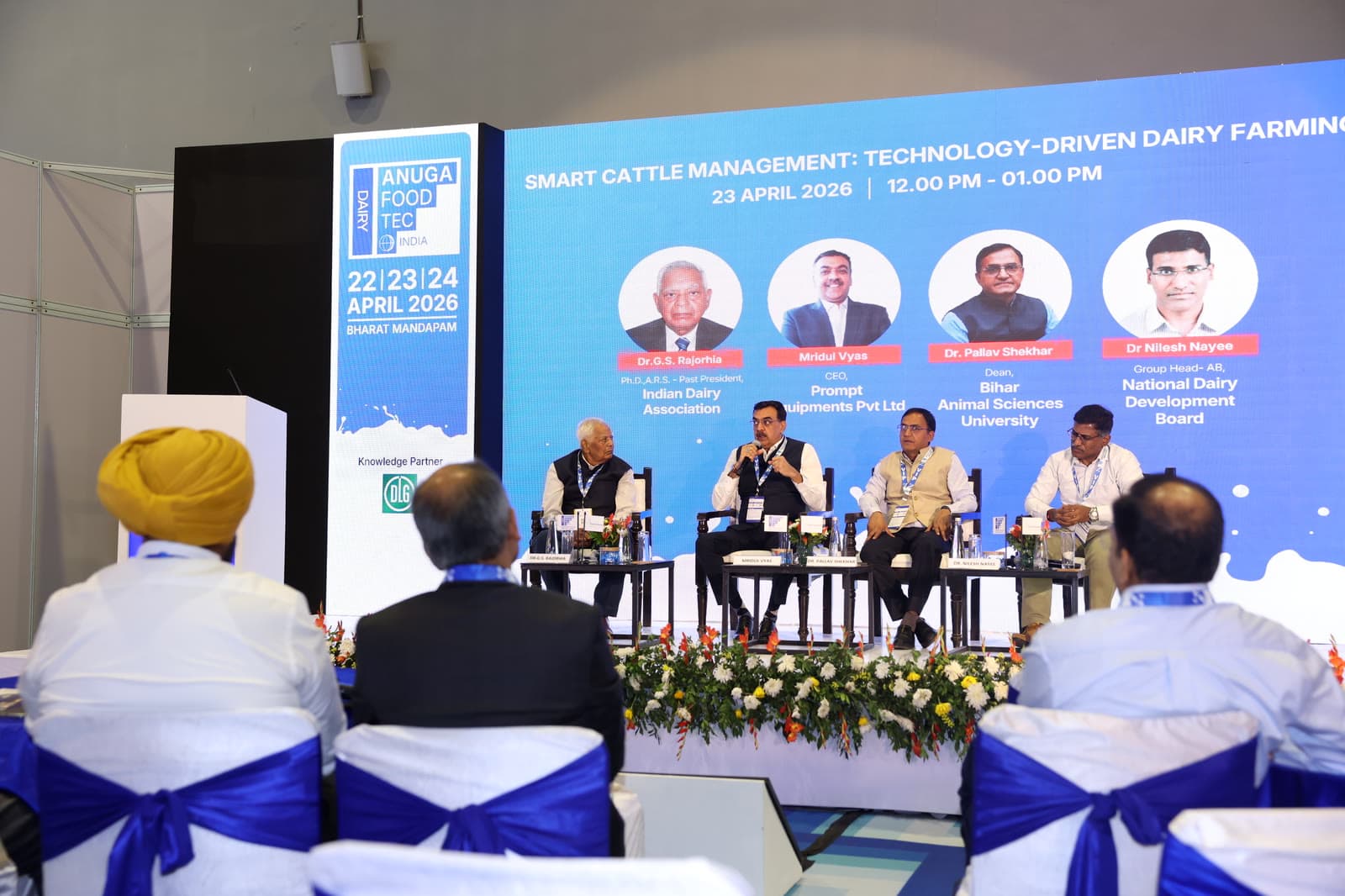 Conference panel discussion with visible audience