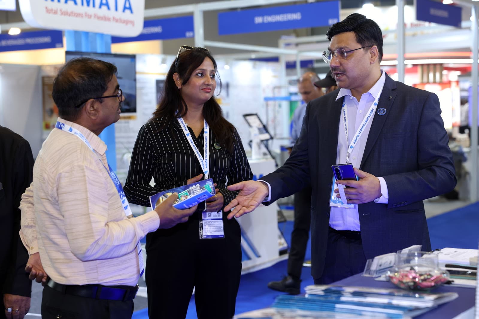 Animated conversation at exhibition booth